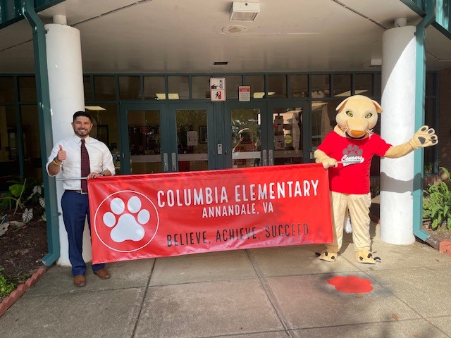 Mr. A and Cougar holding Columbia Banner